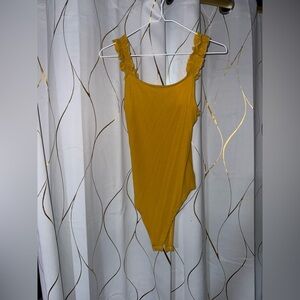 Burnt yellow body suit